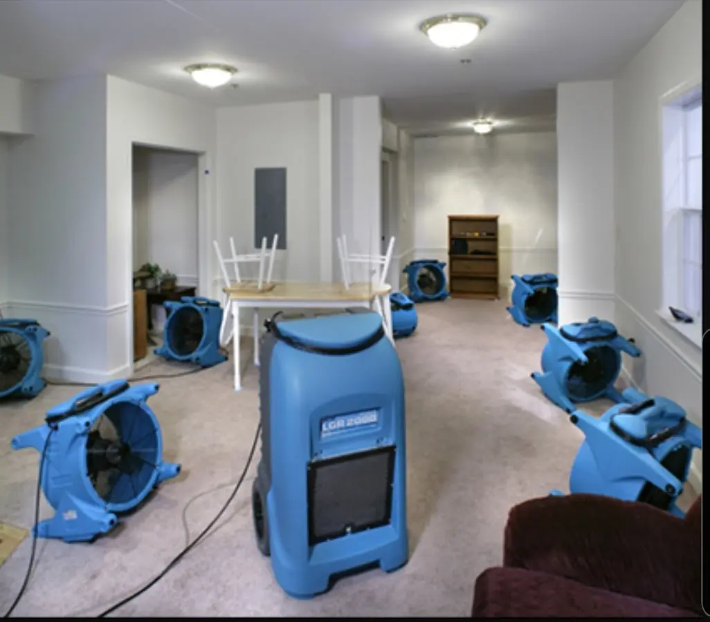 Air movers and dehumidifier setup for Water Damage Restoration in Rosedale